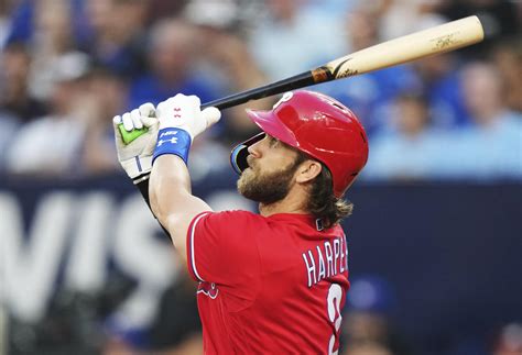 Harper hits 2 solo home runs, Nola pitches 5 innings as Phillies beat Blue Jays 9-4